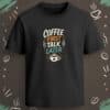 Black regular-fit T-shirt with “Coffee First Talk Later” cream, orange, and teal coffee cup graphic.