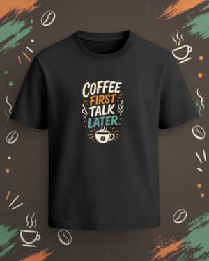Black regular-fit T-shirt with “Coffee First Talk Later” cream, orange, and teal coffee cup graphic.