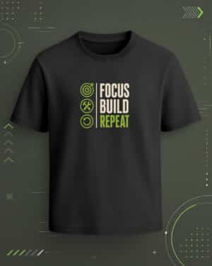 Black regular-fit T-shirt with “Focus Build Repeat” cream and green motivational graphic with goal, build, and repeat icons.