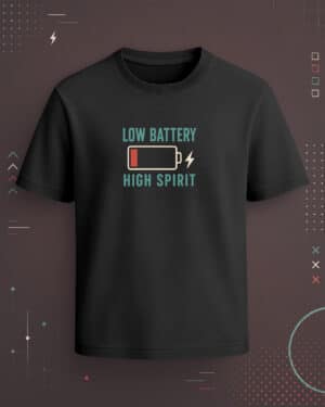 Black regular-fit T-shirt with “Low Battery High Spirit” teal text, battery icon, red low-charge detail, and lightning graphic.