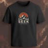 Black regular-fit T-shirt with “Seek Beyond” white text and mountain sunset outdoor graphic.